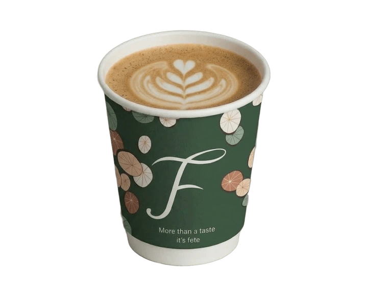 FETE salted honey vanilla coffee in a forest green cup